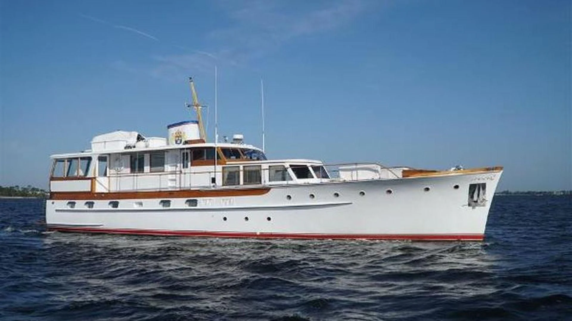 a large white boat on the water aboard LIBERTY LOVE Yacht for Sale