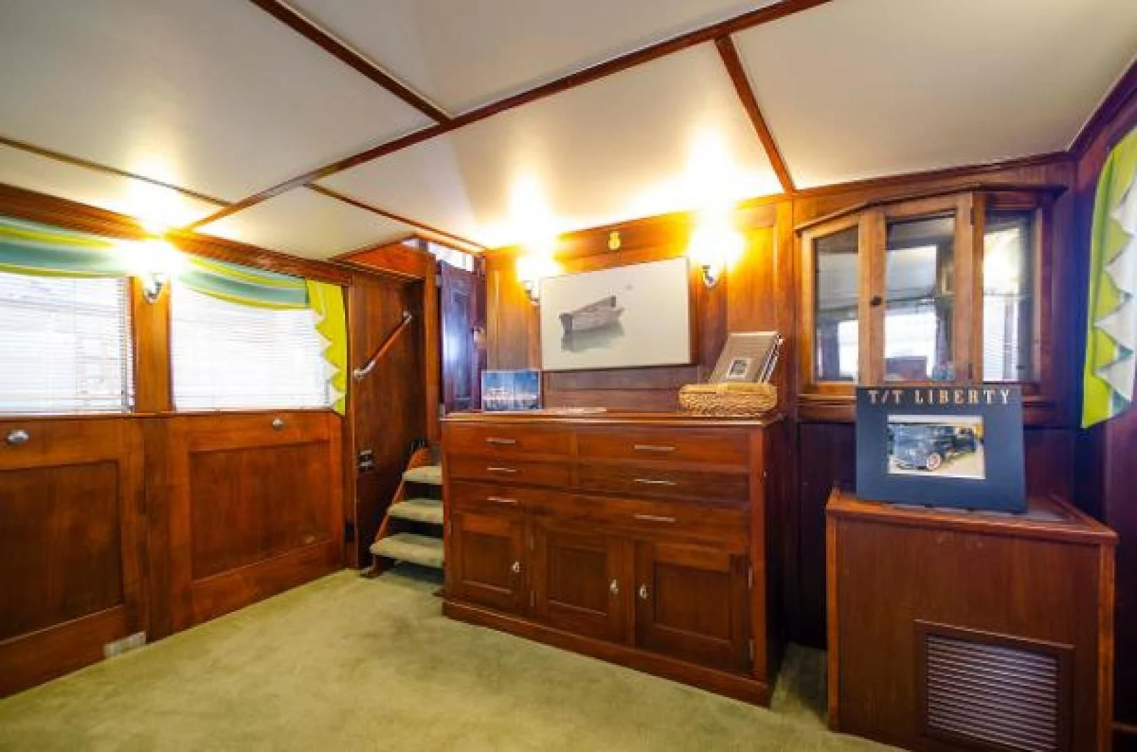 a room with a dresser and a mirror aboard LIBERTY LOVE Yacht for Sale