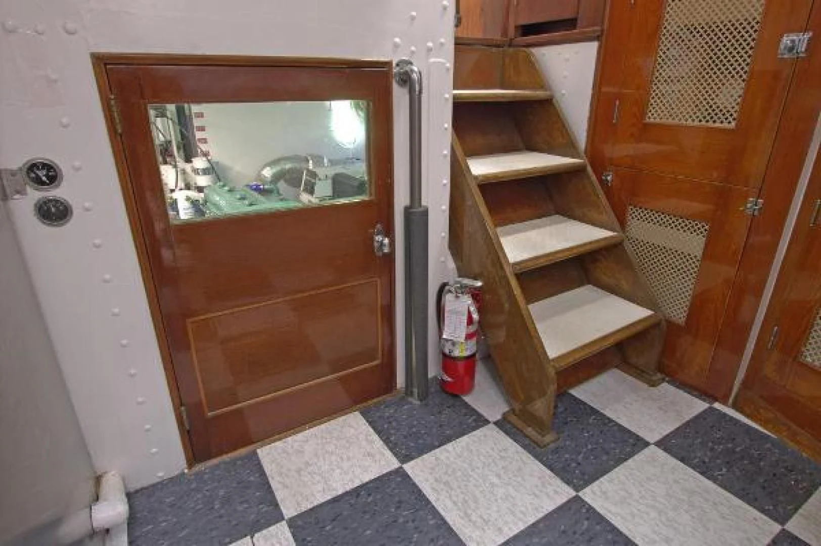 a wood cabinet in a bathroom aboard LIBERTY LOVE Yacht for Sale