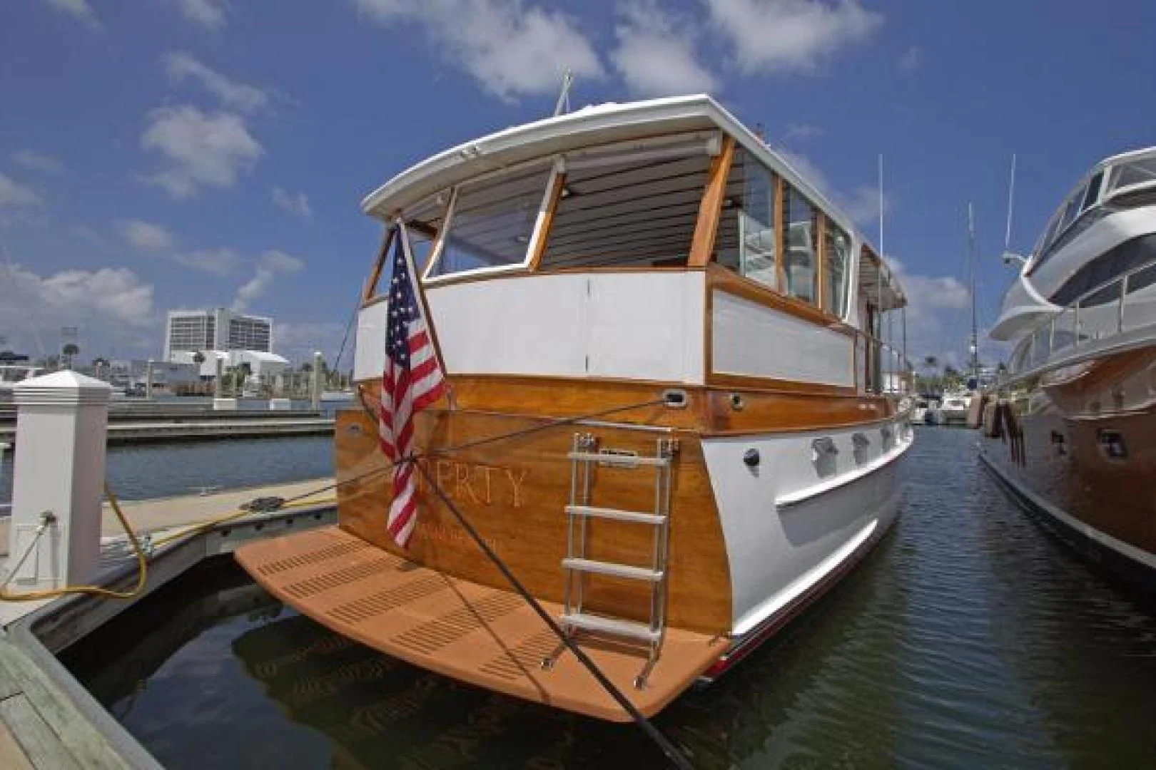 a large boat on a dock aboard LIBERTY LOVE Yacht for Sale
