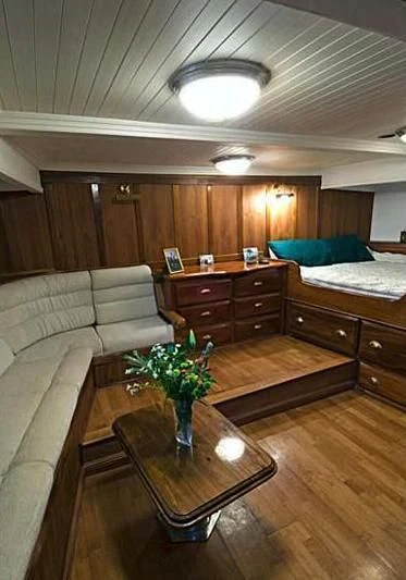 a living room with a couch and a coffee table aboard SEAN PAQUITO IV Yacht for Sale