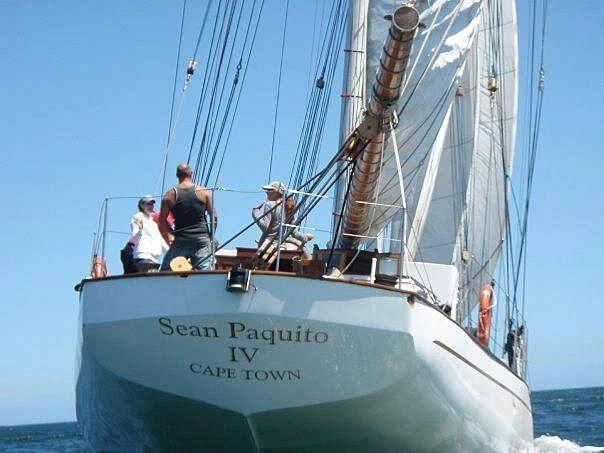 a group of people on a sailboat aboard SEAN PAQUITO IV Yacht for Sale