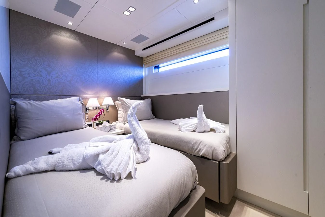 a room with two beds aboard MANATEA Yacht for Sale
