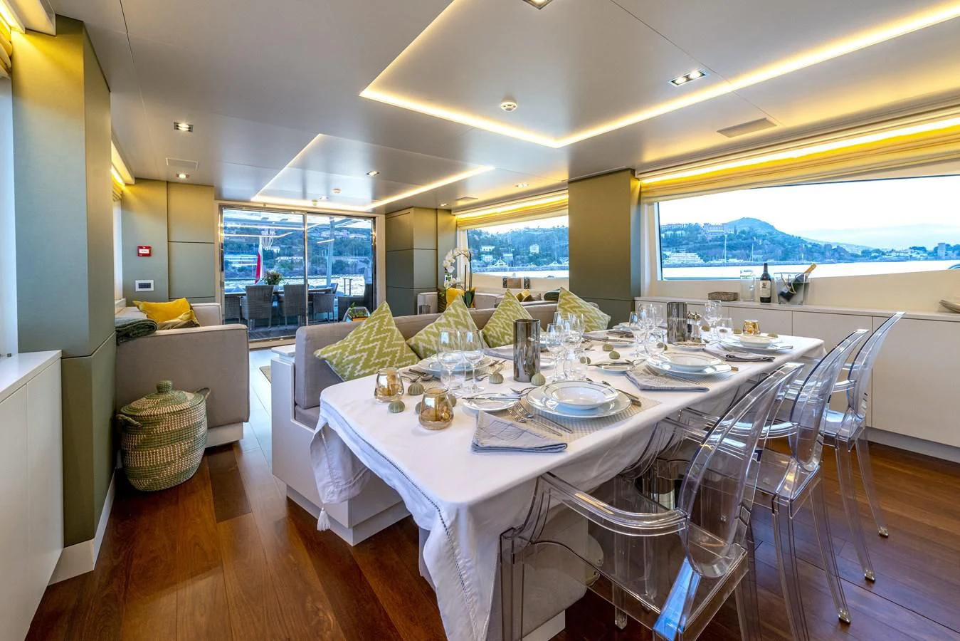 a dining room with white tables and chairs aboard MANATEA Yacht for Sale