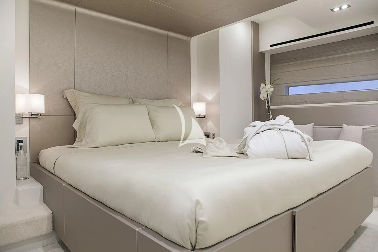 a bed with white sheets aboard MANATEA Yacht for Sale