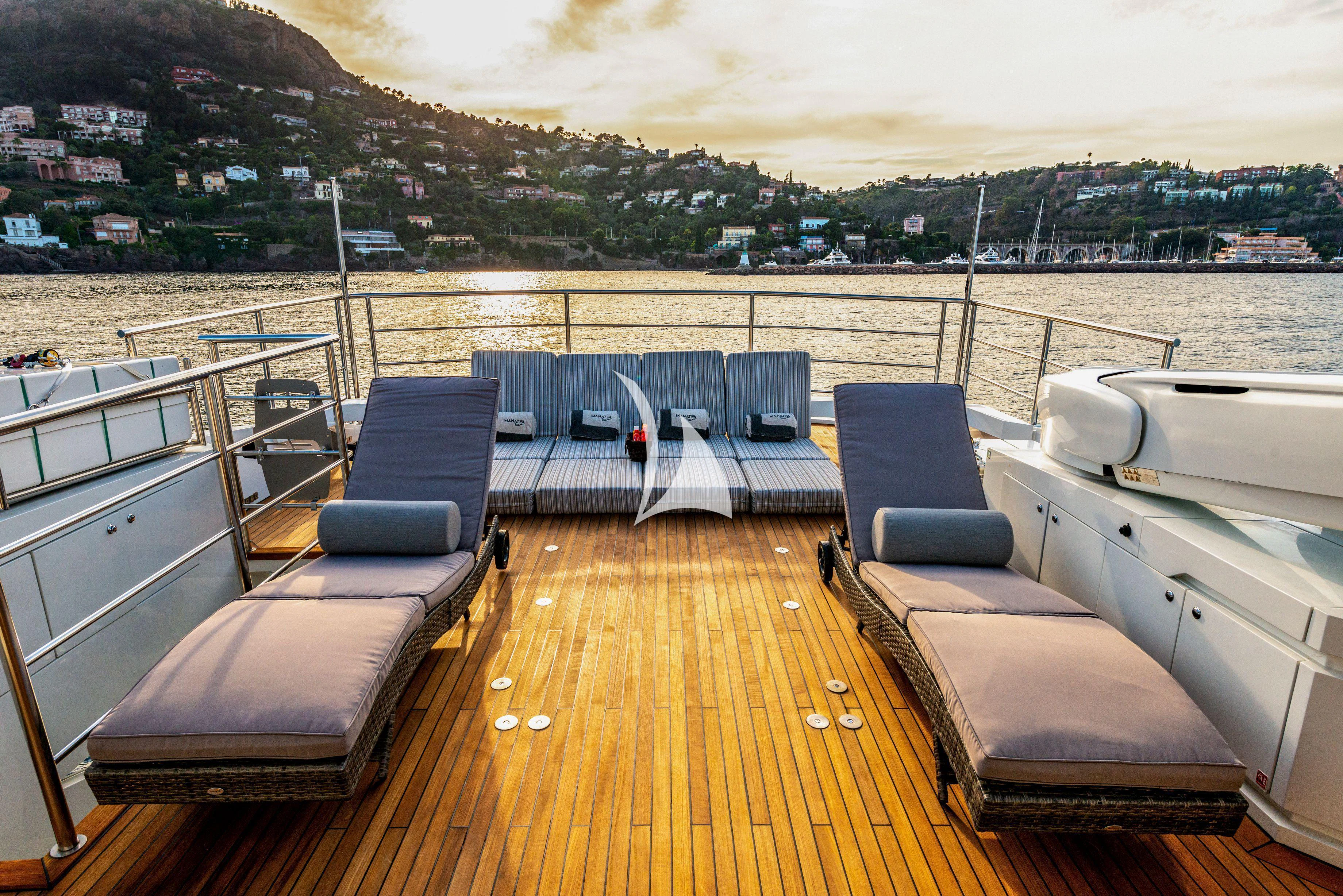 a deck with a deck and chairs aboard MANATEA Yacht for Sale