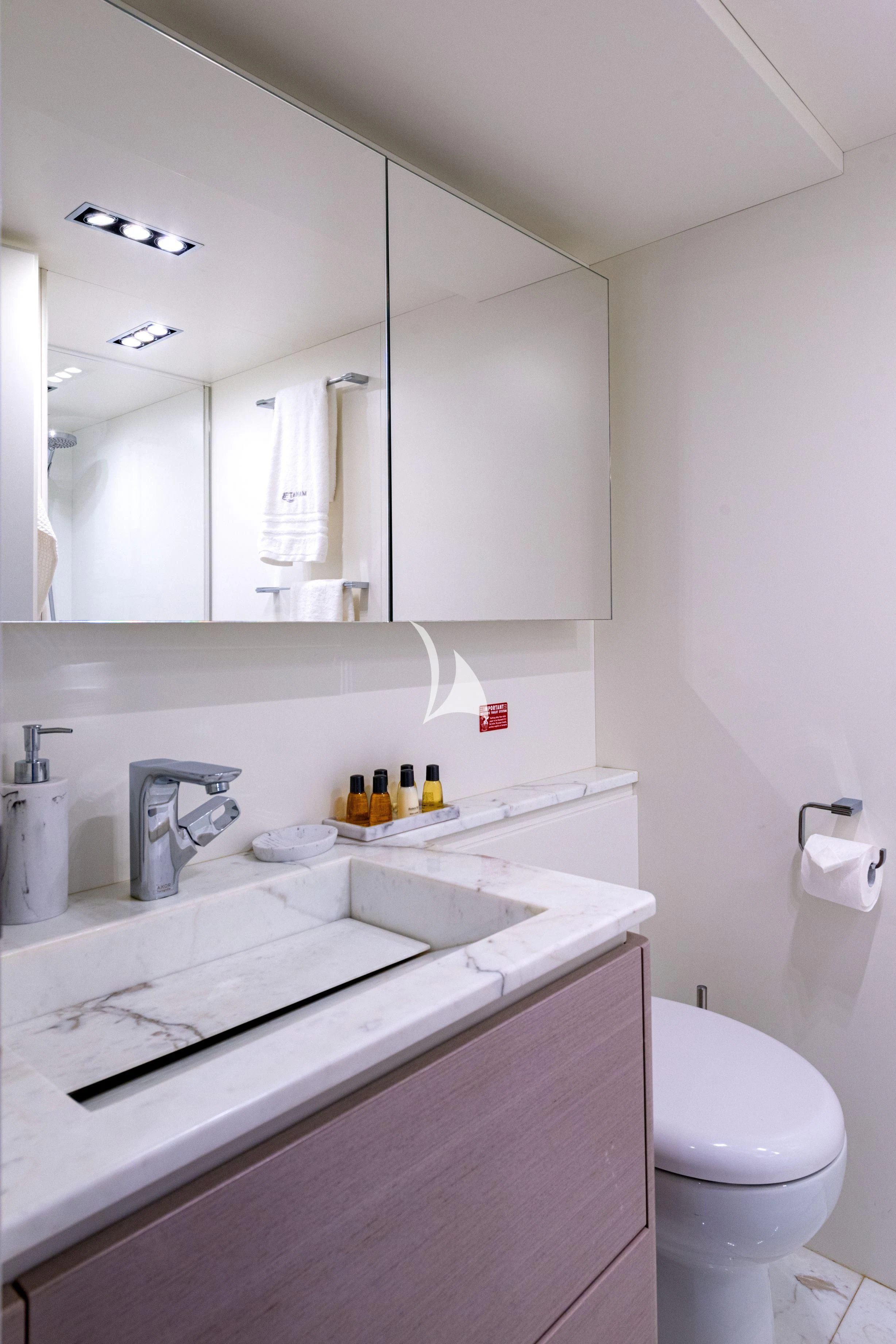 a bathroom with a large mirror aboard MANATEA Yacht for Sale