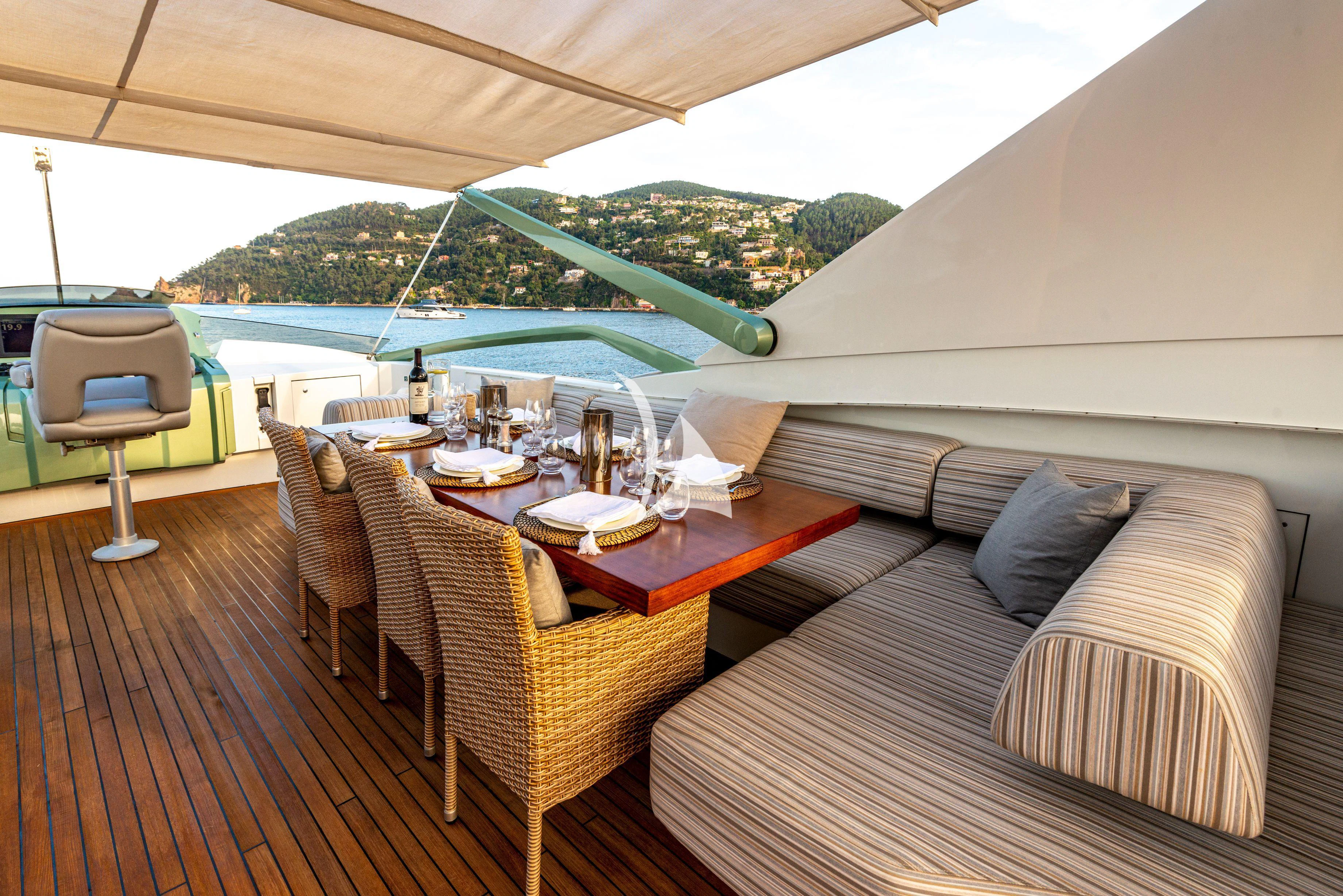 a room with a table and chairs aboard MANATEA Yacht for Sale