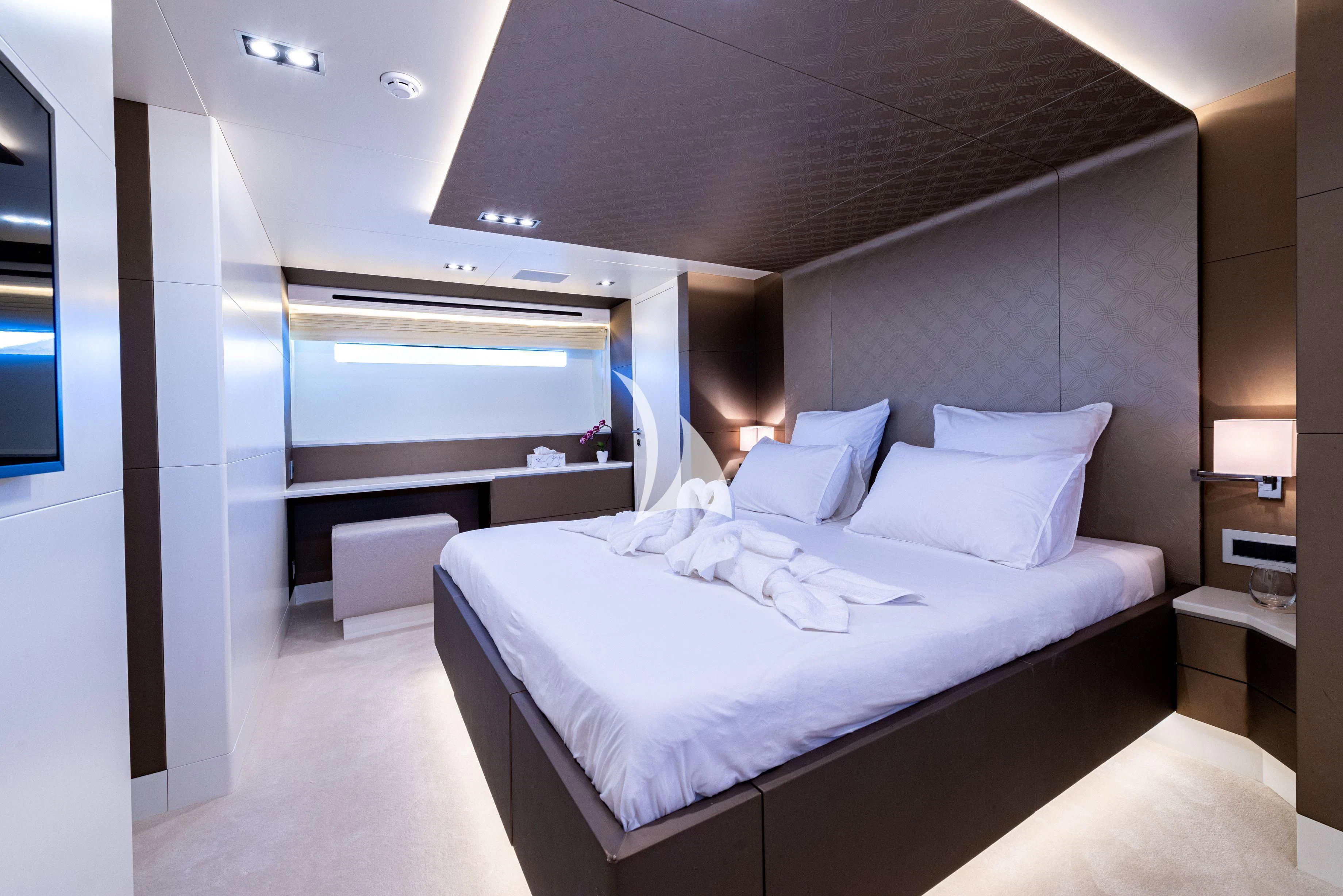 a room with a bed and a desk aboard MANATEA Yacht for Sale