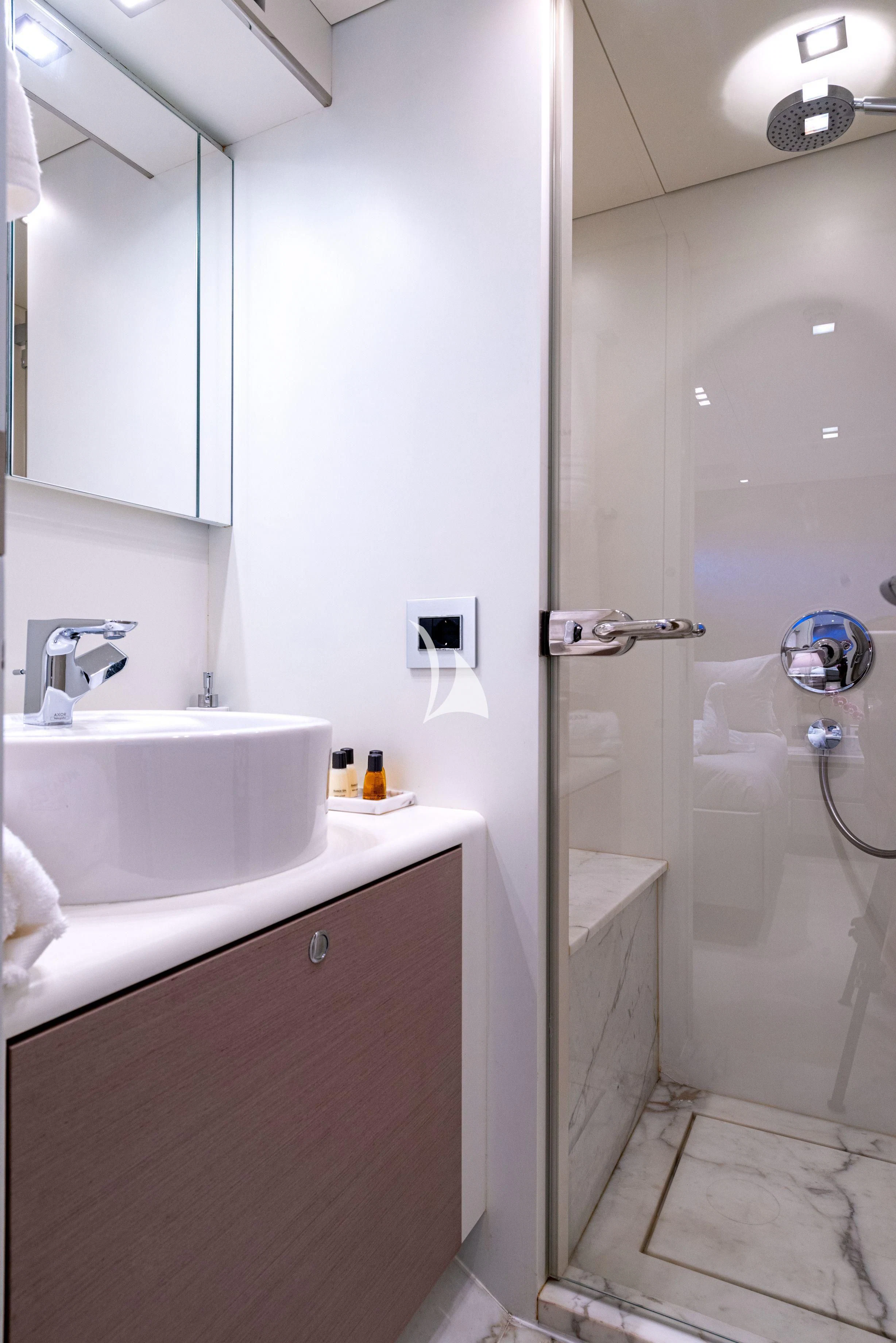 a bathroom with a shower sink and a mirror aboard MANATEA Yacht for Sale