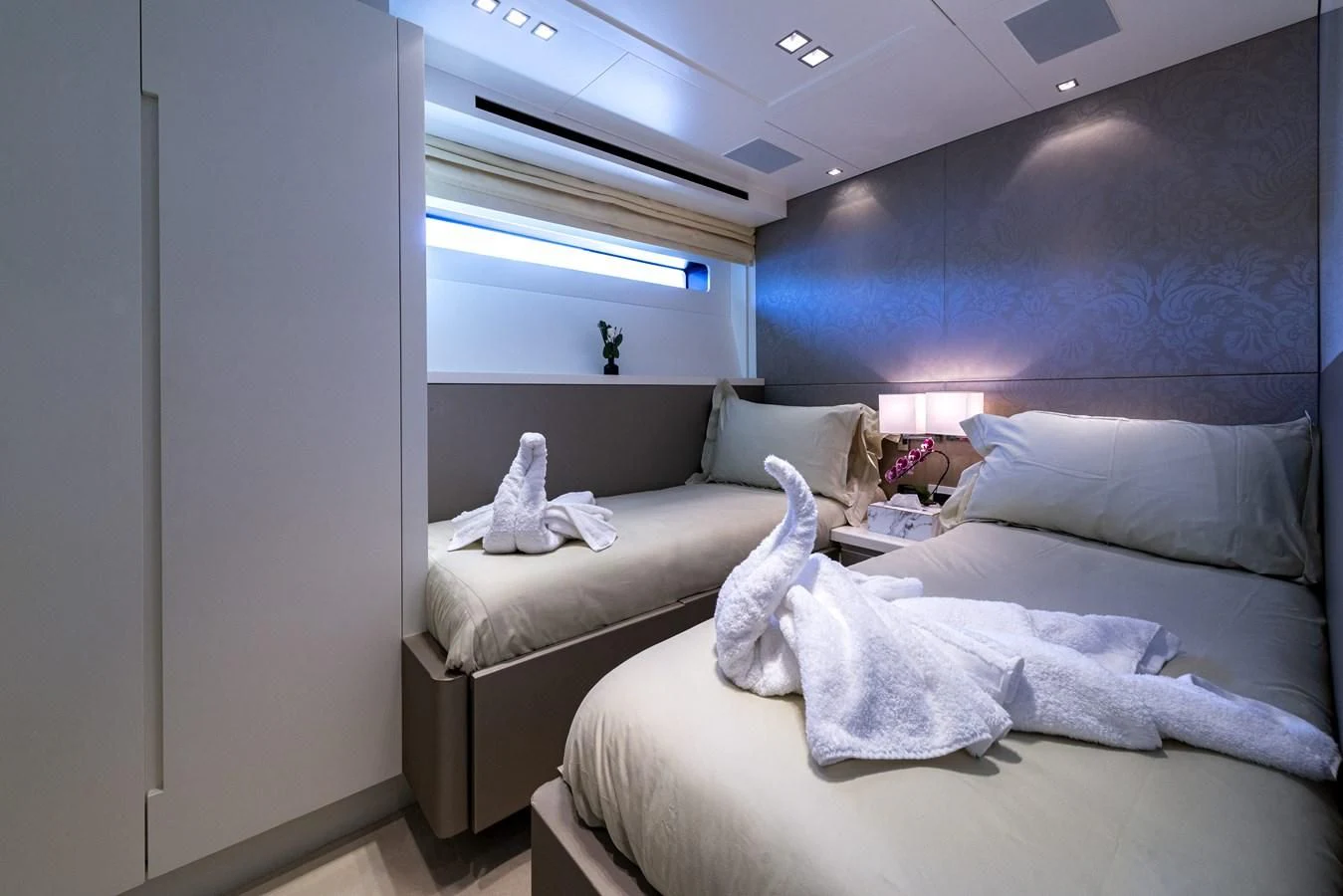 a room with two beds aboard MANATEA Yacht for Sale