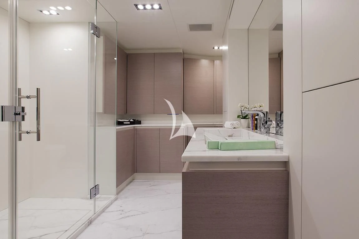 a bathroom with a bathtub and sinks aboard MANATEA Yacht for Sale