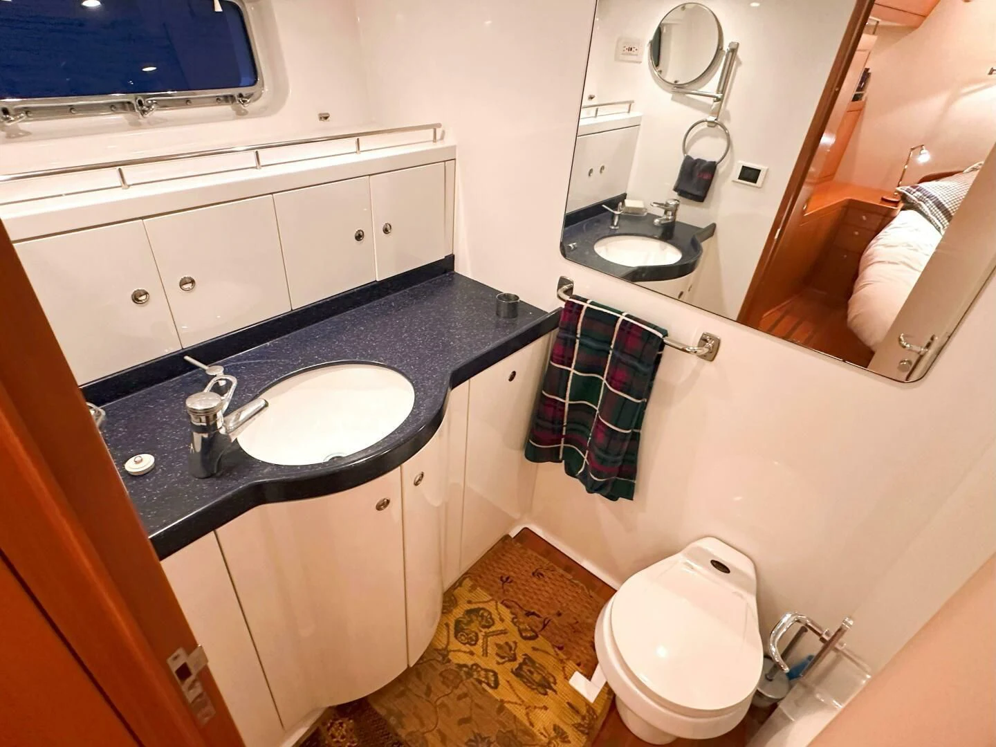 a bathroom with a sink and a toilet aboard LEONORE Yacht for Sale