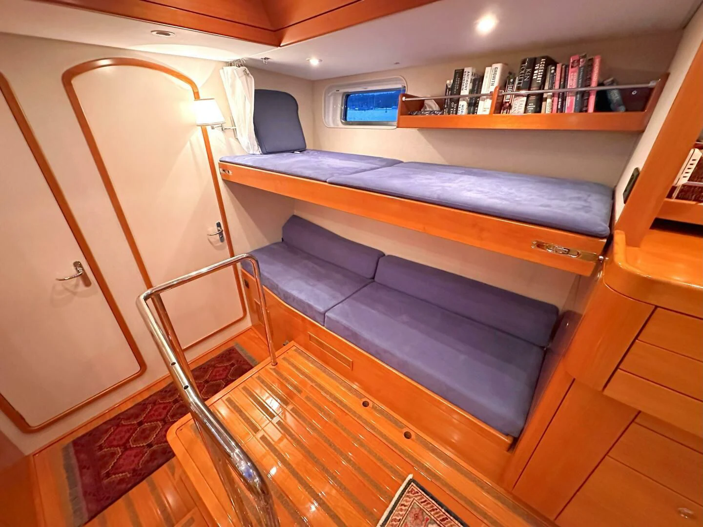 a bed and a chair in a room aboard LEONORE Yacht for Sale
