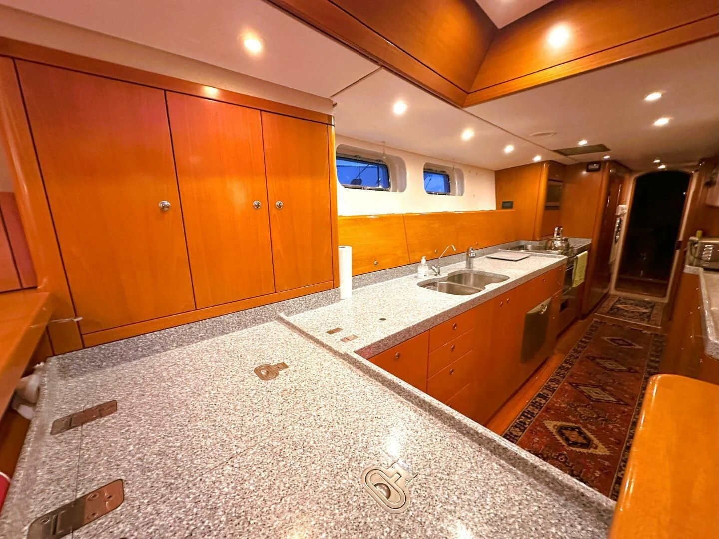 a large kitchen with a large island aboard LEONORE Yacht for Sale