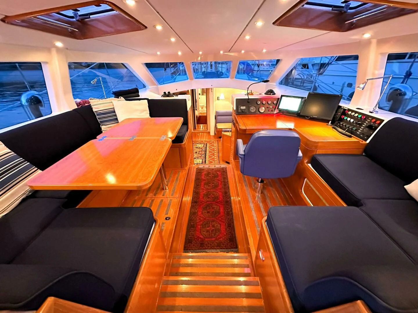 a room with a table and chairs aboard LEONORE Yacht for Sale