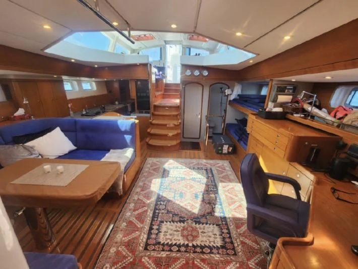 a room with a bed and a desk aboard LEONORE Yacht for Sale