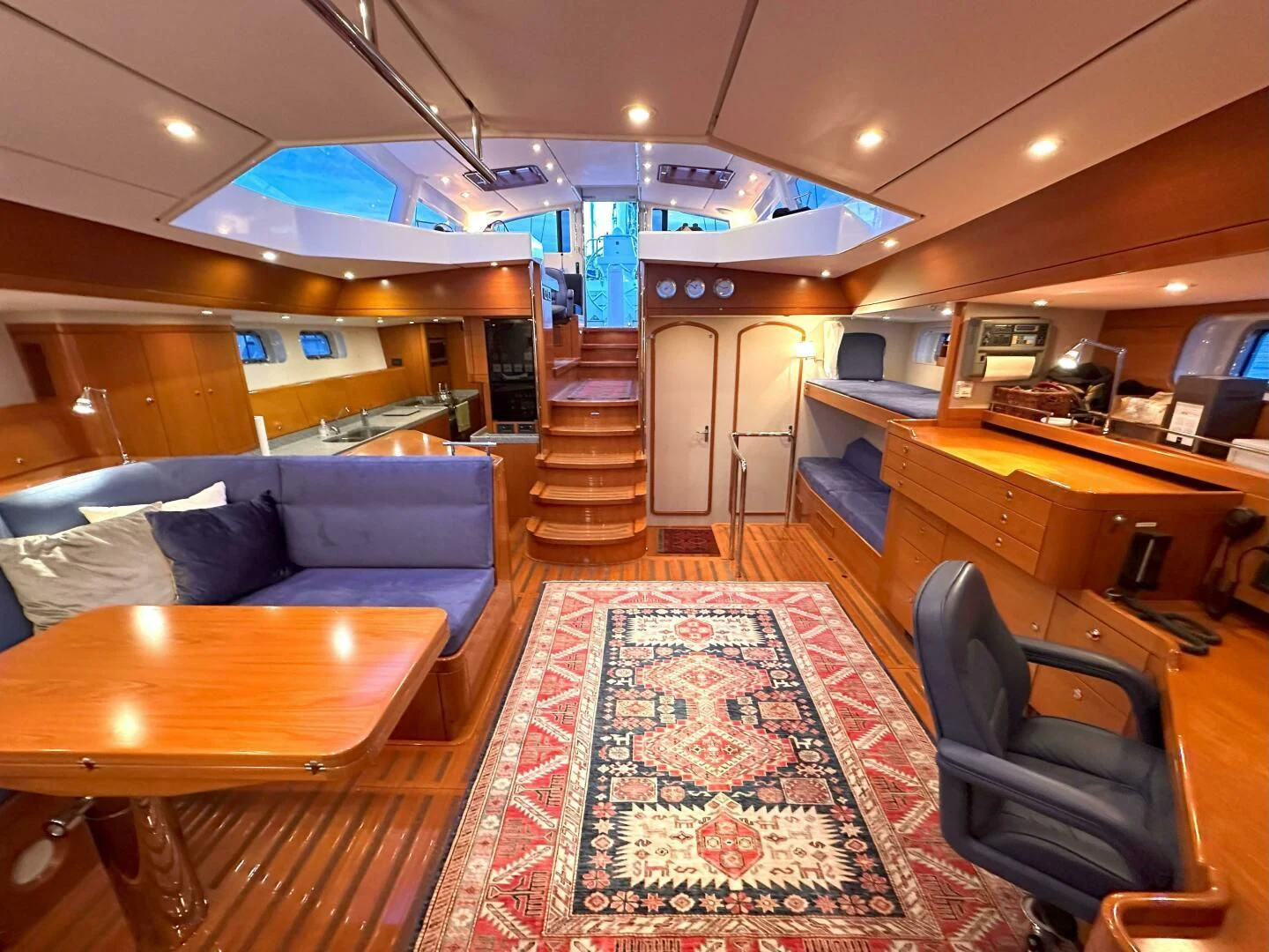 a large room with a couch and a table aboard LEONORE Yacht for Sale