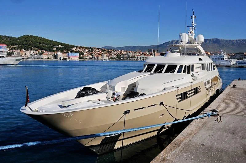 a boat docked at a pier aboard MUZA Yacht for Sale