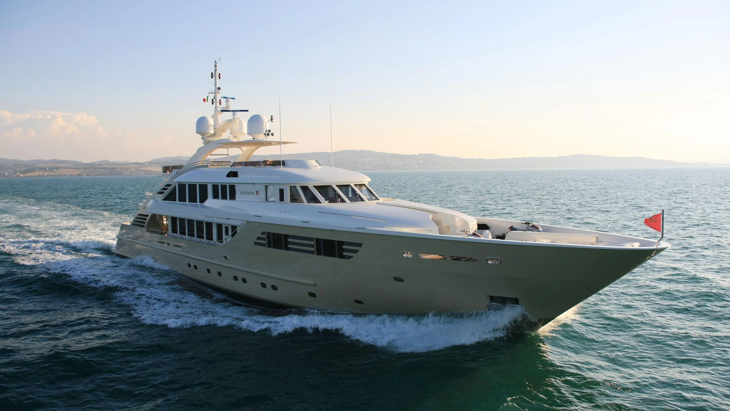 a large white ship in the water aboard MUZA Yacht for Sale