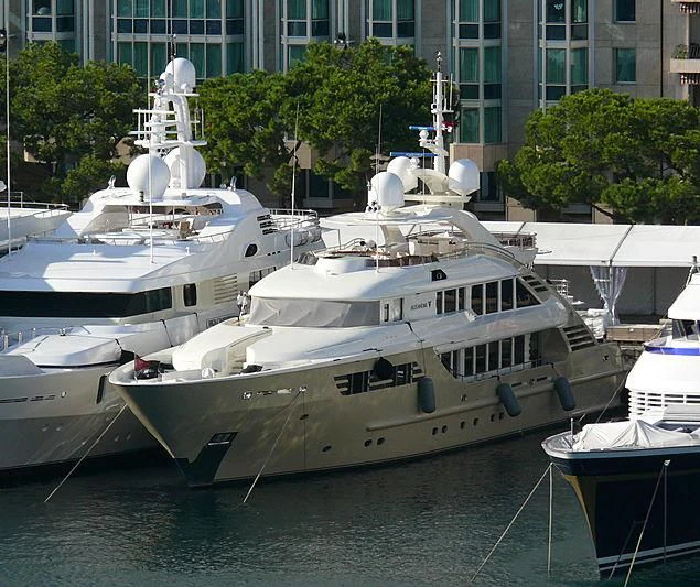 a group of boats are parked in a harbor aboard MUZA Yacht for Sale