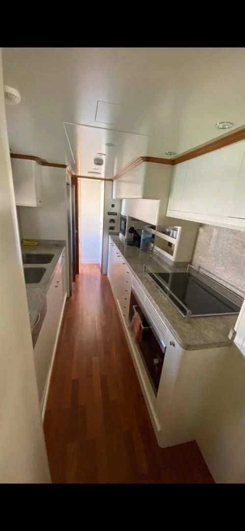 a kitchen with a sink and cabinets aboard LA BELLA SARA III Yacht for Sale