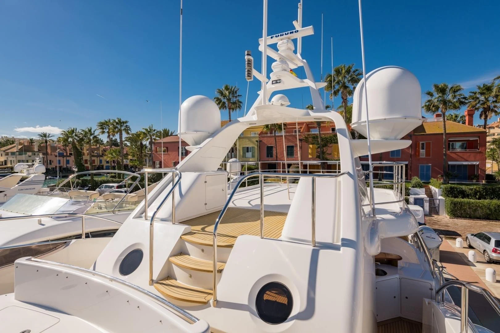 a white boat in a harbor aboard LA BELLA SARA III Yacht for Sale