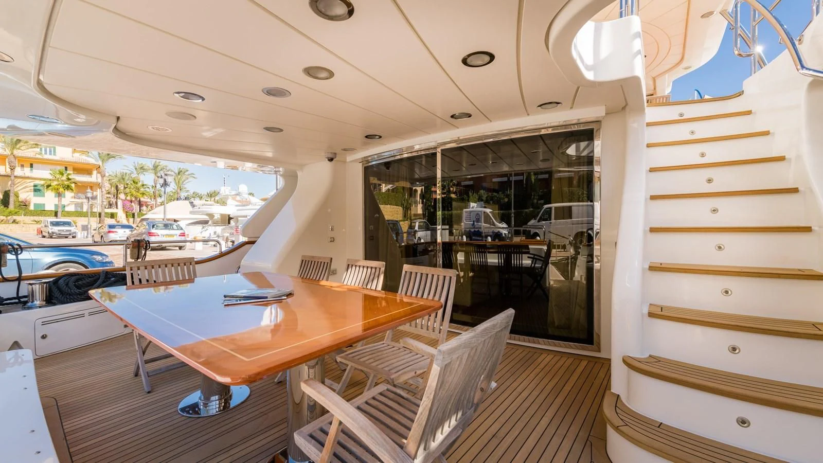 a room with a table and chairs aboard LA BELLA SARA III Yacht for Sale