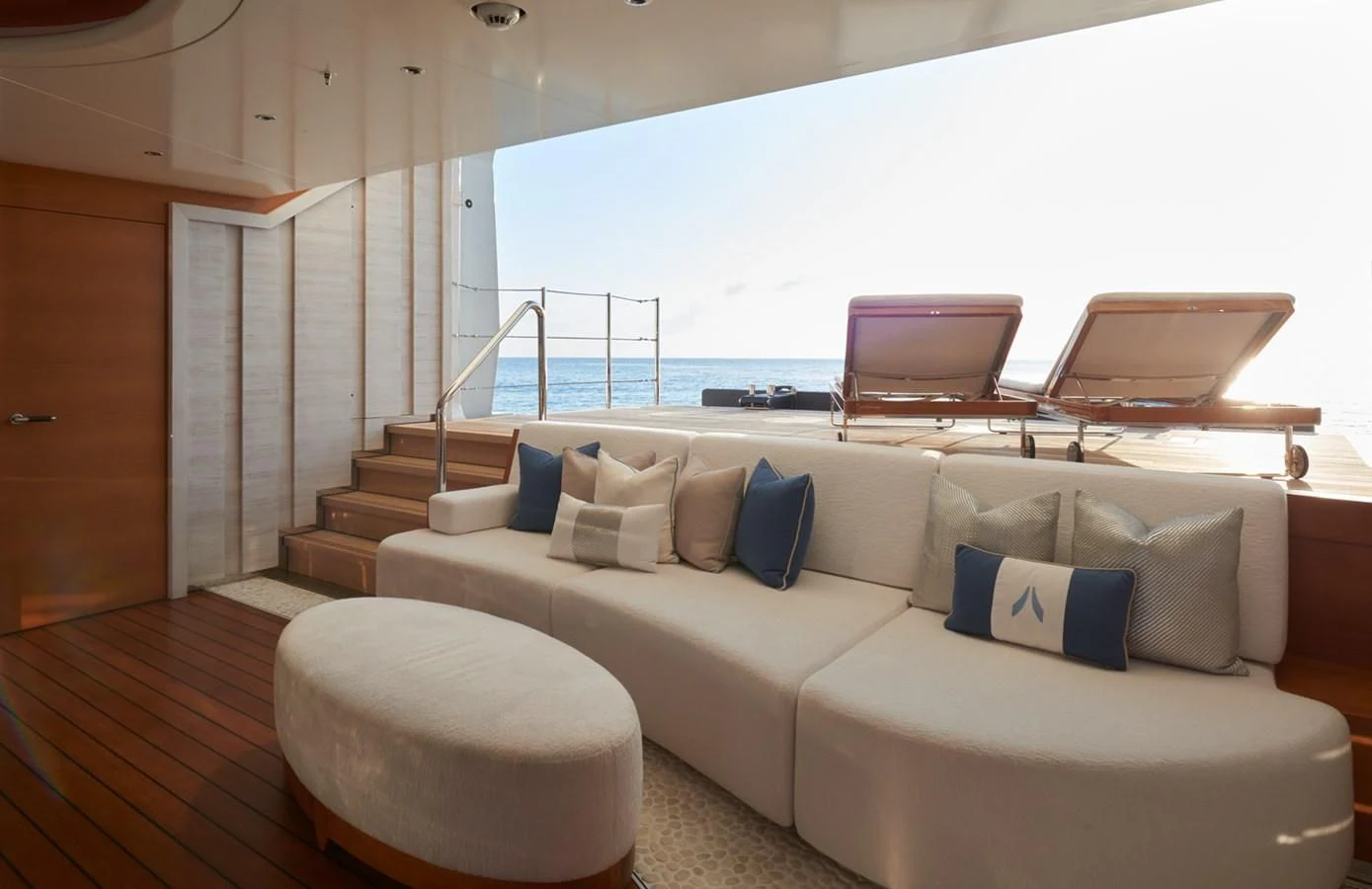 a living room with a large balcony aboard ARROW Yacht for Sale
