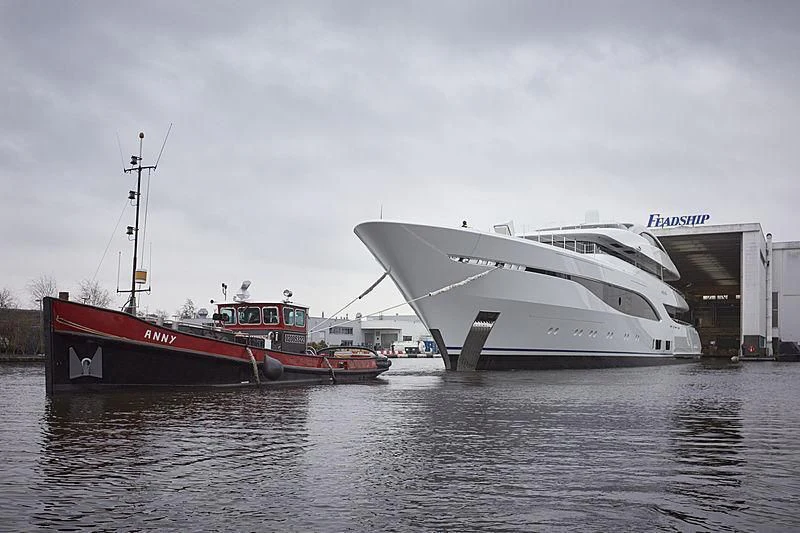a boat docked next to a boat aboard ARROW Yacht for Sale