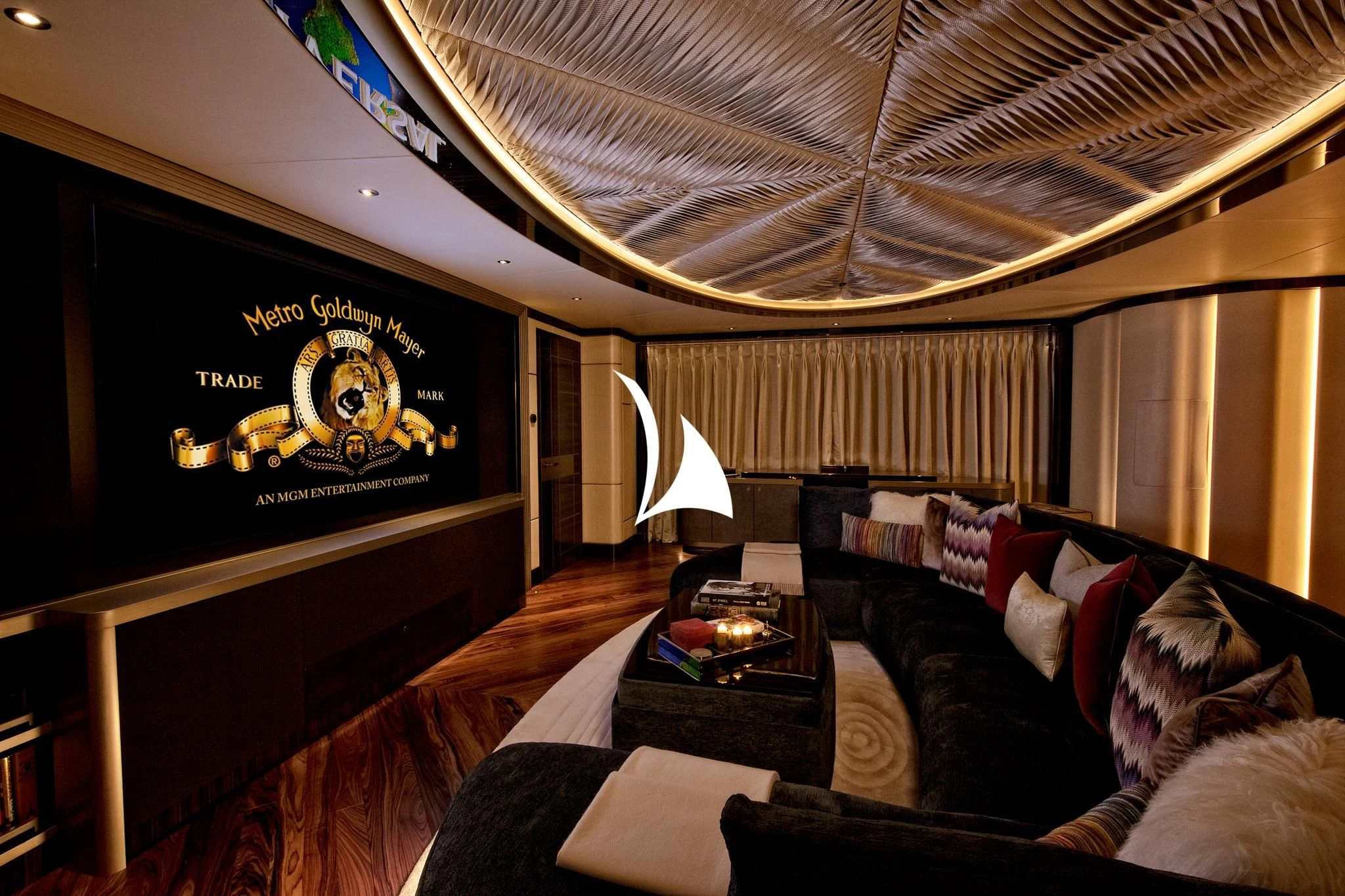 a living room with a large screen aboard ARROW Yacht for Sale