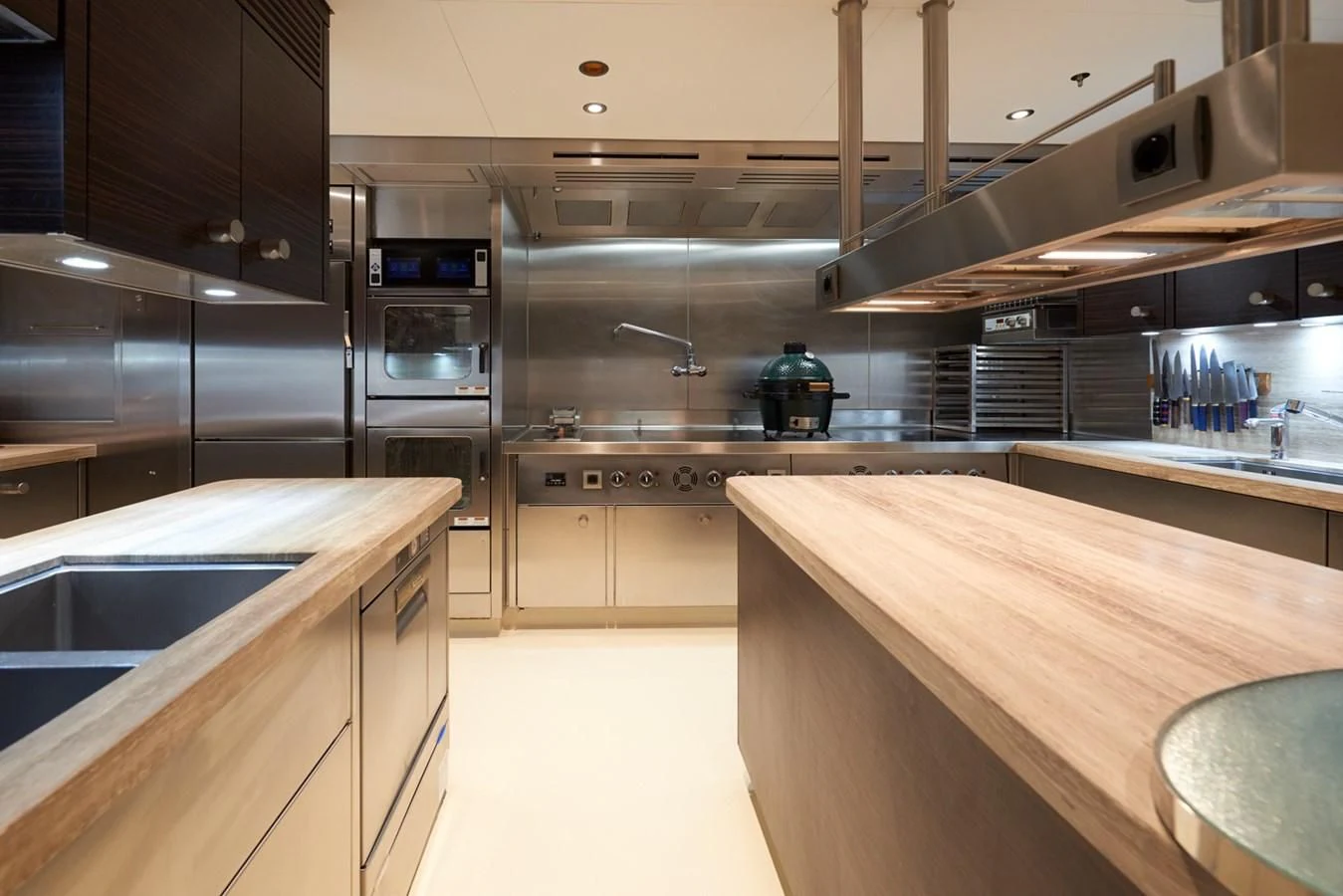 a kitchen with stainless steel appliances aboard ARROW Yacht for Sale