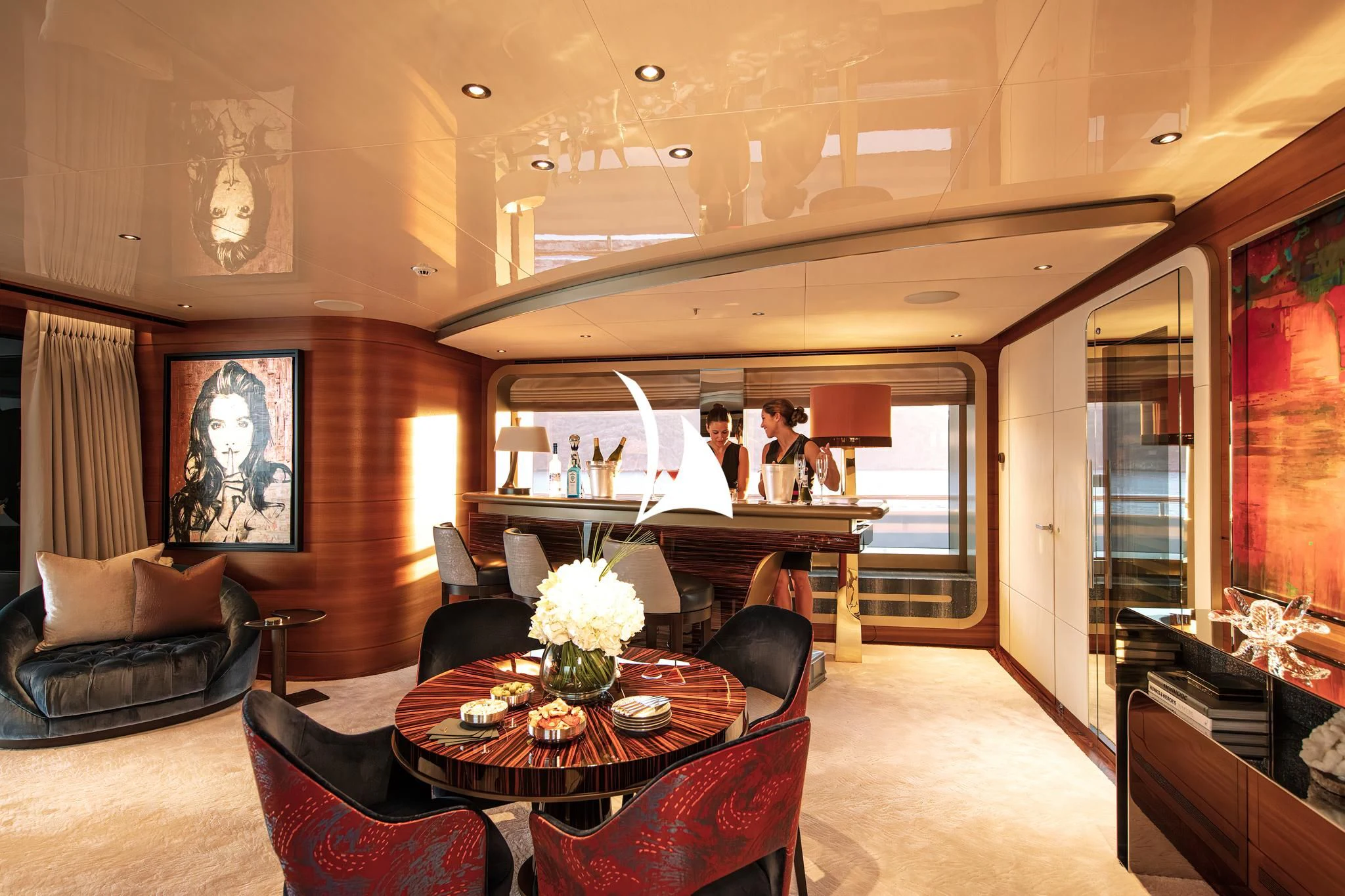 a room with a table chairs and a couch aboard ARROW Yacht for Sale