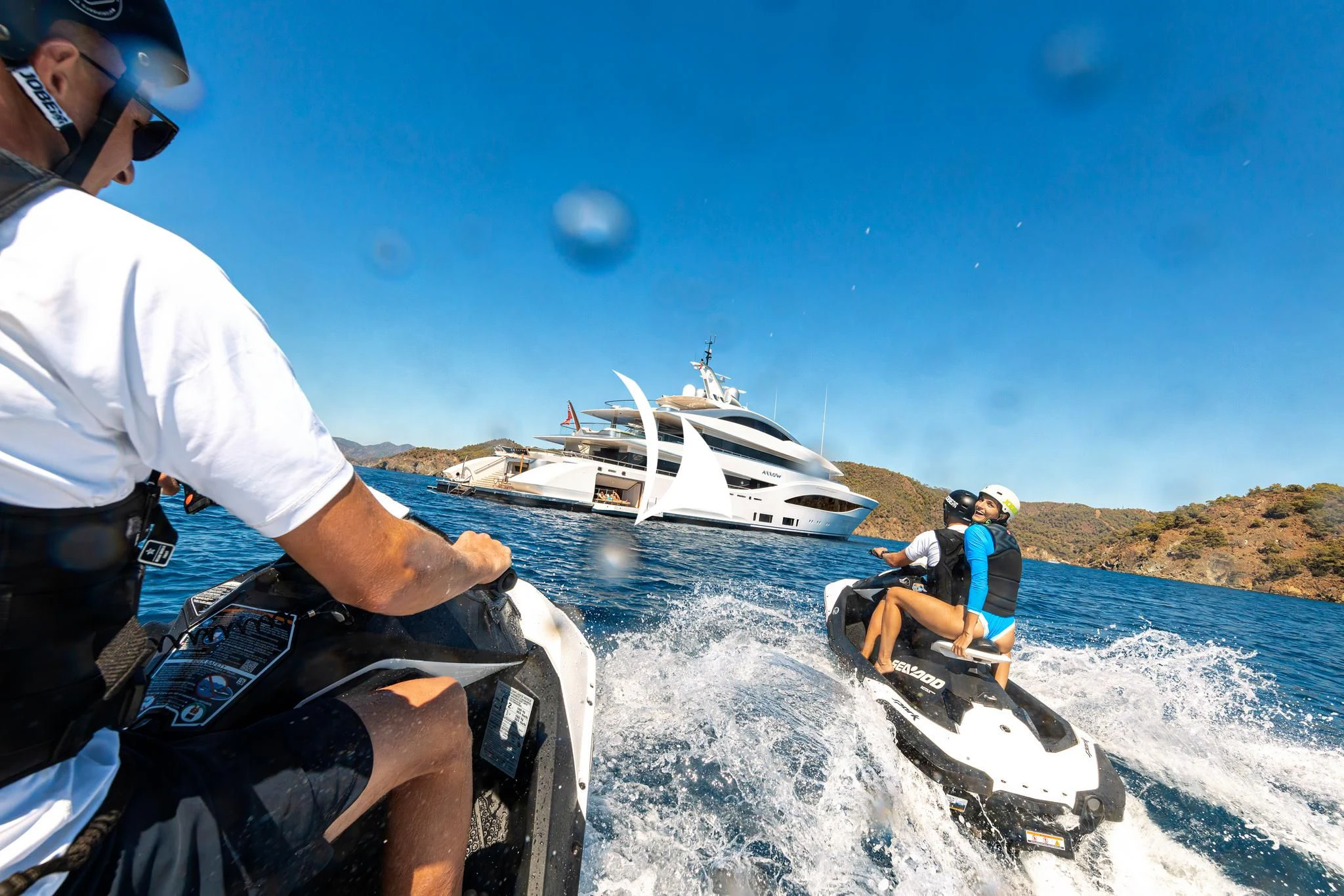 a man and a woman on a boat in the water aboard ARROW Yacht for Sale