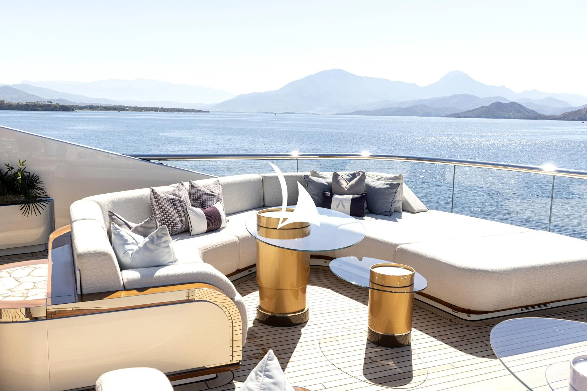 a balcony with a view of the ocean and mountains aboard ARROW Yacht for Sale