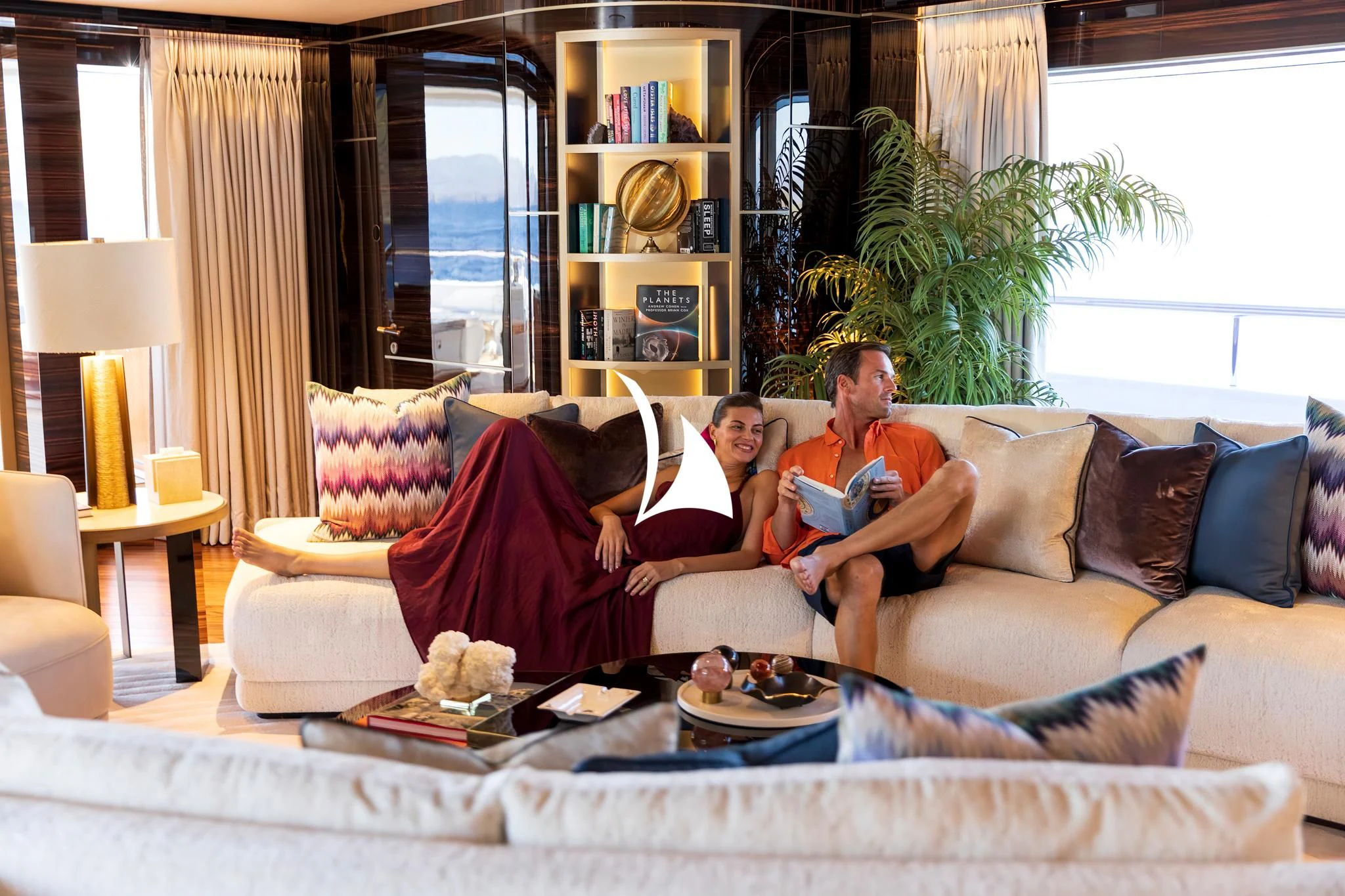a couple of men sitting on a couch aboard ARROW Yacht for Sale