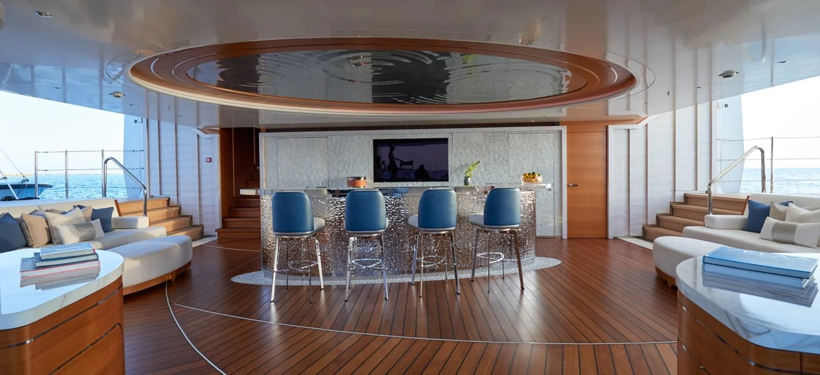 a room with a table chairs and a couch aboard ARROW Yacht for Sale