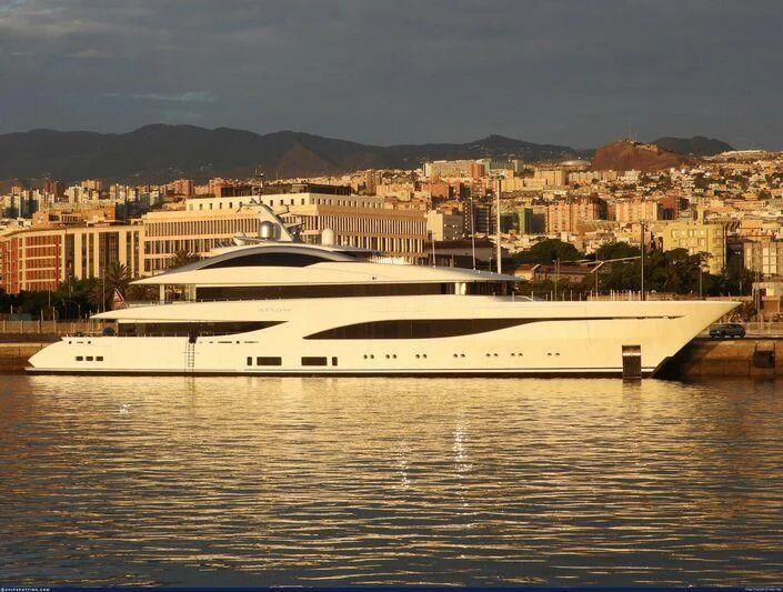 a large white boat in a body of water aboard ARROW Yacht for Sale
