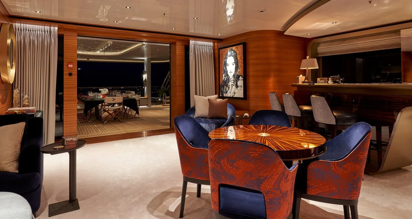a room with a table chairs and a couch aboard ARROW Yacht for Sale