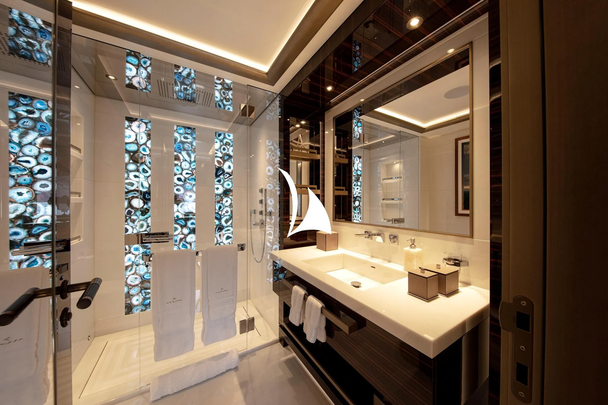 a bathroom with a large mirror aboard ARROW Yacht for Sale