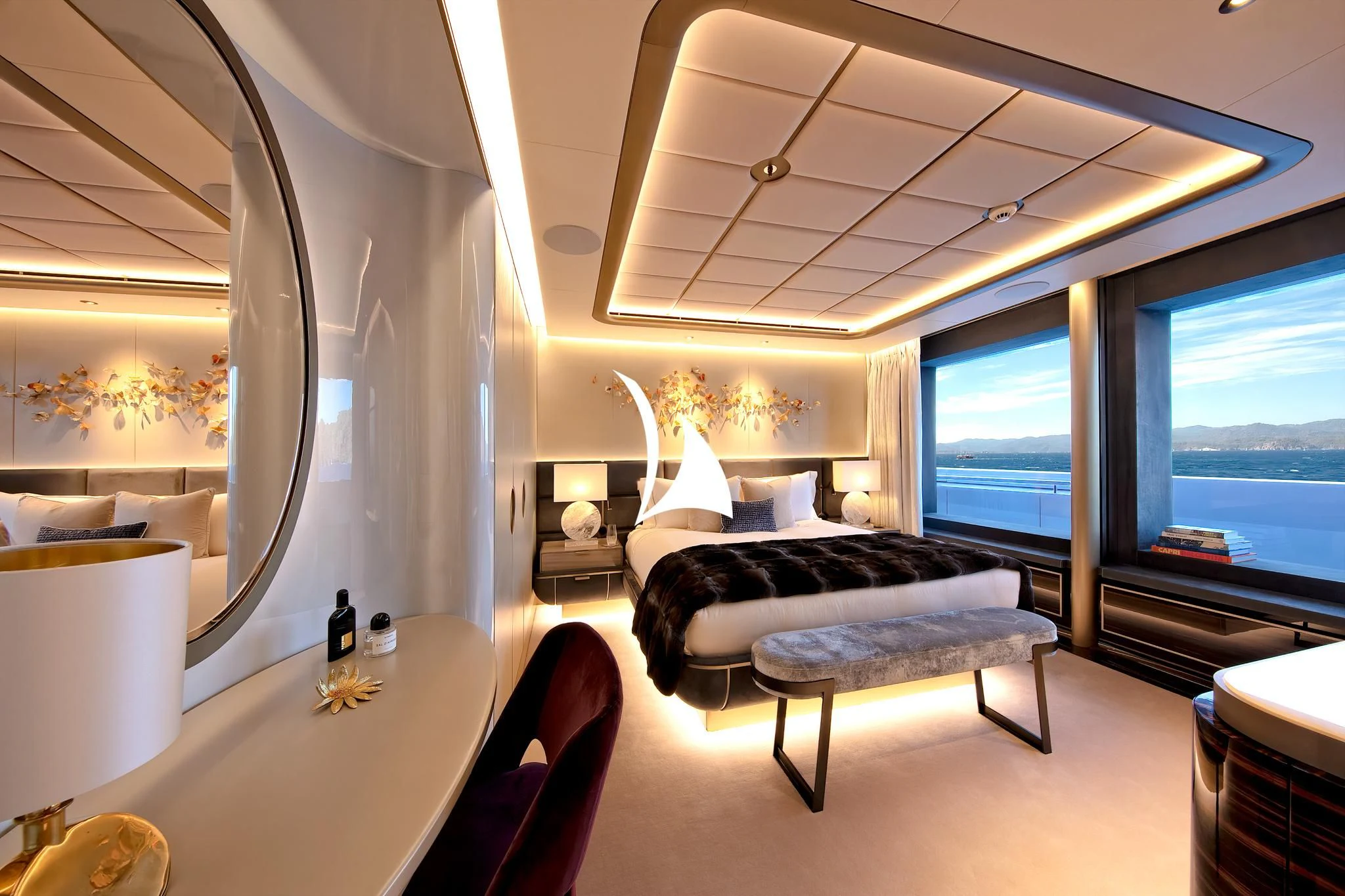 a room with a bed and a table aboard ARROW Yacht for Sale