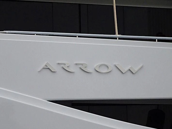 a white rectangular sign with black text aboard ARROW Yacht for Sale