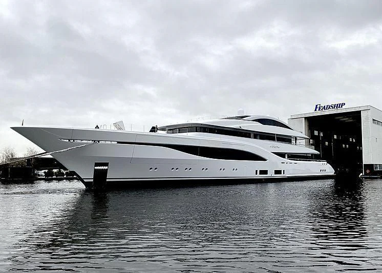 a large white yacht in a body of water aboard ARROW Yacht for Sale