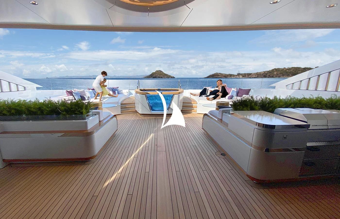 a deck with a couple of people sitting on it aboard ARROW Yacht for Sale