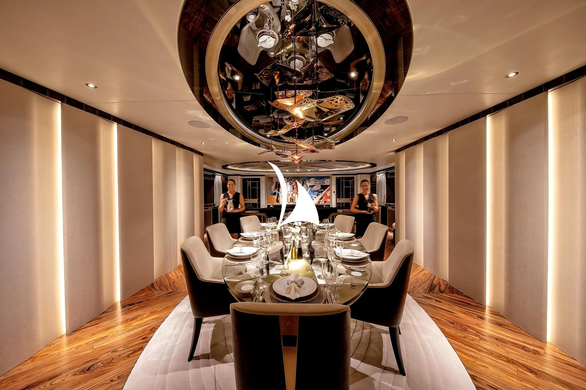 a dining room with a chandelier aboard ARROW Yacht for Sale