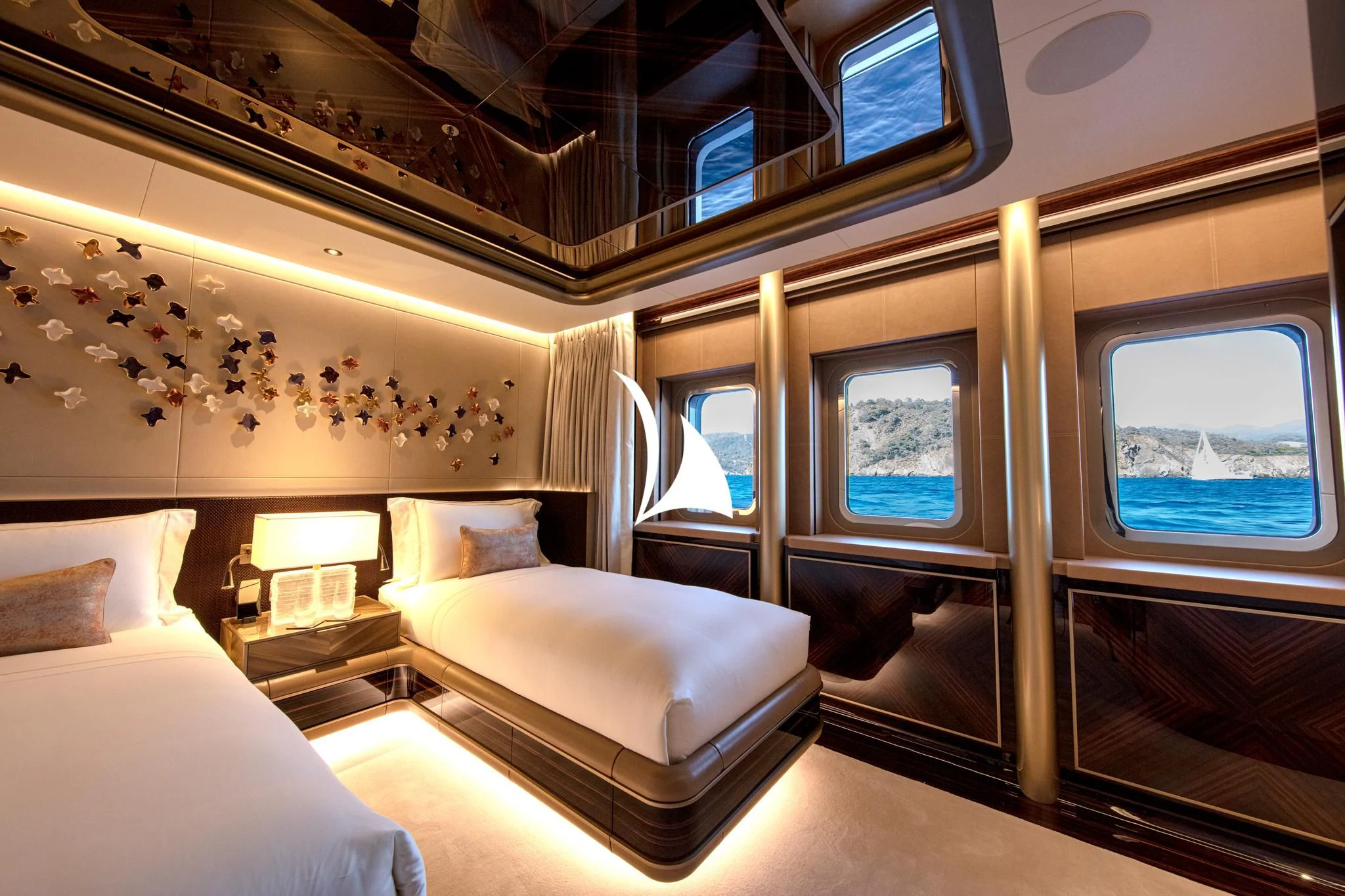 a room with a bed and a couch aboard ARROW Yacht for Sale