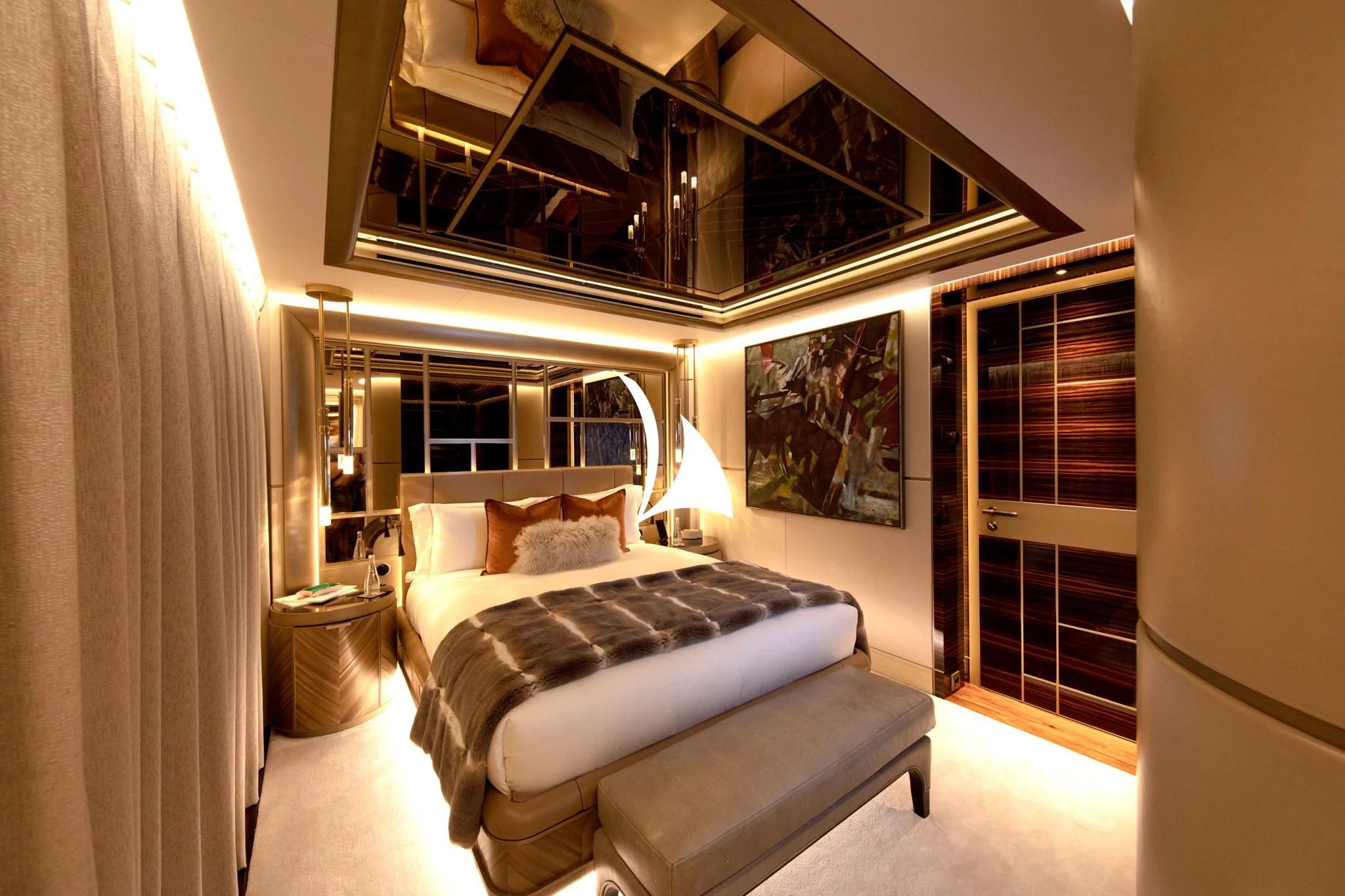 a bedroom with a bed and a mirror aboard ARROW Yacht for Sale