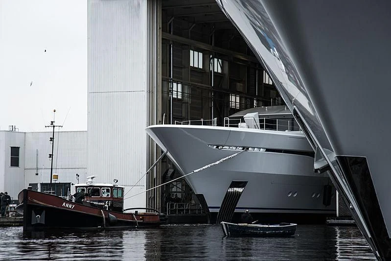 a boat docked in front of a building aboard ARROW Yacht for Sale