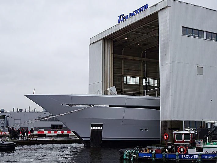 a building with a boat in the water aboard ARROW Yacht for Sale