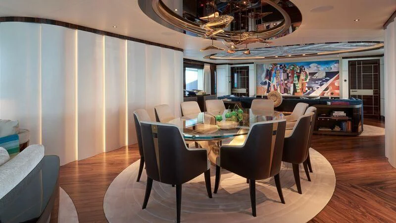 a dining room with a table and chairs aboard ARROW Yacht for Sale